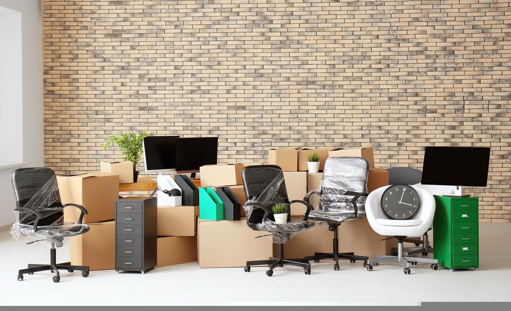 Office relocation in Essex showing team packing desks and IT equipment for secure transport